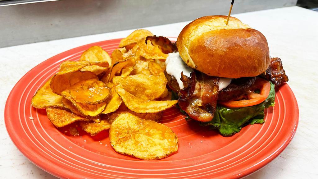 Black & Bleu Burger · Broiled with black pepper coating and topped with house made bleu cheese sauce, applewood smoked bacon, lettuce and tomato.