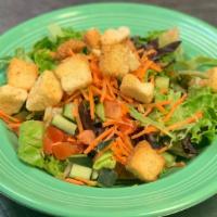 House Salad · Mixed greens with diced tomato, diced cucumber and shredded carrots. Finished with croutons ...