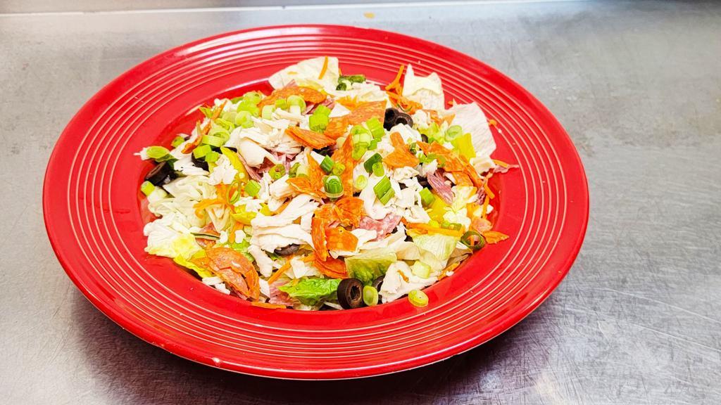 Italian Chef Salad · Fresh greens tossed with carrots, pepperoncini's, black olives and five cheese blend.  Topped with diced turkey, salami and pepperoni, then finished with green onions and Italian spices.  Served with a creamy herb dressing.