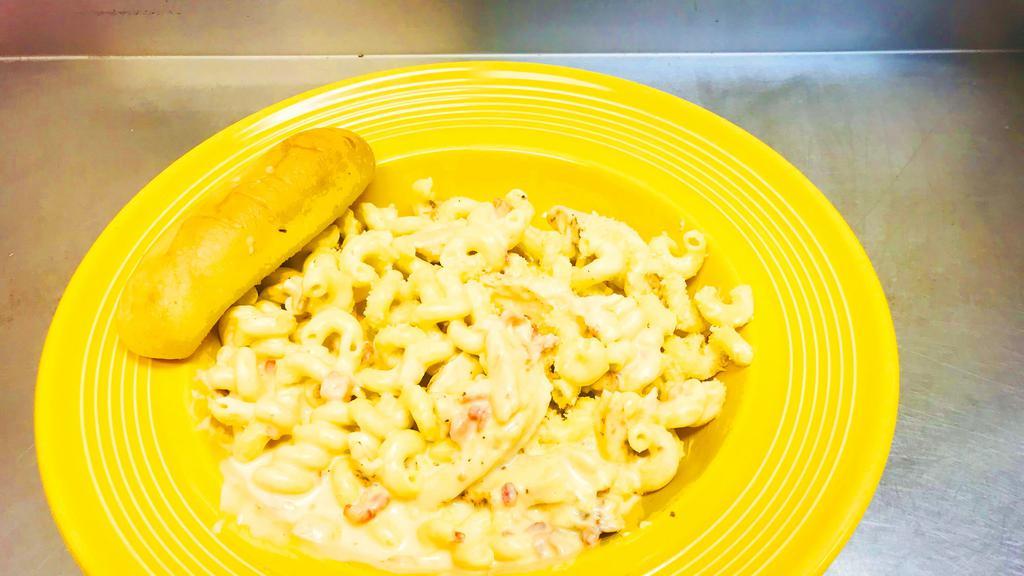 Chick Bacon Mac · Cavatappi noodles, grilled chicken and smoked applewood bacon tossed in our house made beer cheese sauce.