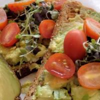 Avocado Toast · Whole Wheat 21 Grains Bread (2 Slices) With Sliced Avocado, Tomatoes Topped With Microgreens.