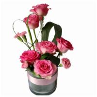 Blush · 5-6 Pink roses, mini carnations and Greenery in clear glass vase
Vase size 6''