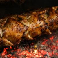 Combo Familiar · 2 South American rotisserie chickens brined for 12 hours + slow cooked over wood charcoal to...