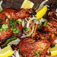Tandoori Chicken · Half chicken (leg & breast) marinated in spices and baked in Tandoor (clay oven)