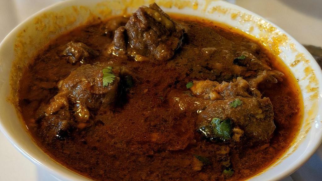 Goat Curry · Tender bone in goat sauteed in ginger and garlic, marinated in himalayan spices, cooked well in mild tomato and onion sauce.