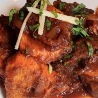 Himalayan Karahi · Boneless chicken and lamb cooked in onion tomato base sauce with red pepper, green pepper, o...