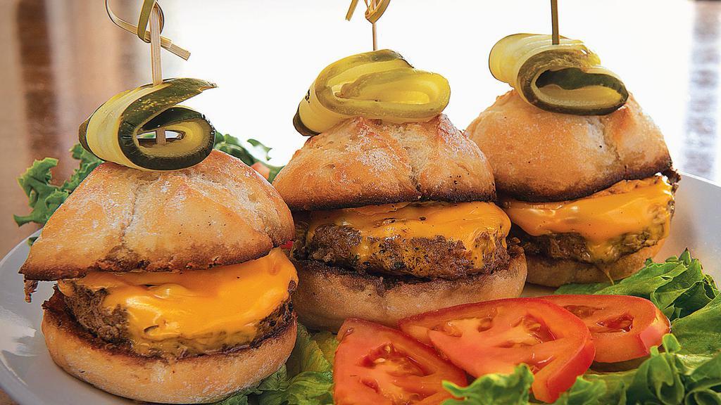 Kobe Sliders · Three juicy burgers topped with American cheese, served on tuscan mini-buns.