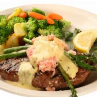Steak Oscar · Tender angus sirloin topped with crab meat, bearnaise, and asparagus spears. Include soup or...