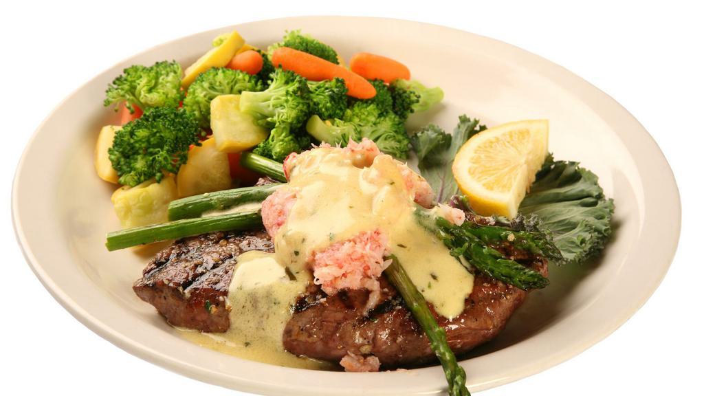 Steak Oscar · Tender angus sirloin topped with crab meat, bearnaise, and asparagus spears. Include soup or garden salad and garlic mashed potatoes, fries, steamed vegetables, steamed asparagus, or rice.