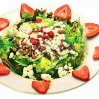 Glacier Salad · Greens topped with sliced strawberries, cucumber, dried cranberries, candied pecans, and fet...