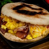 La Americana · Scrambled eggs, Choice of Meat (bacon/ham/sausage/chorizo) and Jack Cheddar Cheese