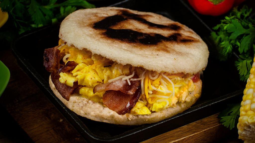 La Americana · Scrambled eggs, Choice of Meat (bacon/ham/sausage/chorizo) and Jack Cheddar Cheese