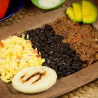 El Criollo · ”Our Signature Venezuelan Breakfast”  Shredded Seasoned Beef, Seasoned Black Beans, Scramble...