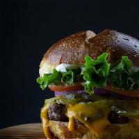 Red Coat · A British favorite. 1/3 lb beef patty, lettuce, tomato, onion, pickle, melted Cheddar, and g...