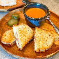 Omg Grilled Cheese · layered gruyere, whipped brie, goat cheese, white cheddar, smoked bacon, creamy tomato soup ...