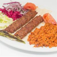 Adana Kebab · Ground lamb flavored with red bellpepper and chef's blend of spices, grilled on skewers over...