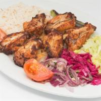 Chicken Wings · Chicken wings marinated in chef's special blend of spices and grilled over coal fire. Served...