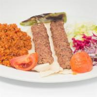 Chicken Adana Kebab · Ground chicken flavored with red pepper and spices, grilled over coal fire on skewers. Serve...