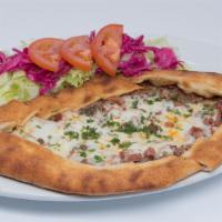 Mixed Pide · Thick dough stuffed with Turkish sausage, Turkish salami, ground meat and mozzarella cheese,...