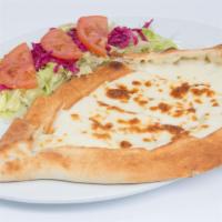Cheese Pide · Vegetarian. Thick dough stuffed with a cheese blend, baked in a brick oven. Served with a si...