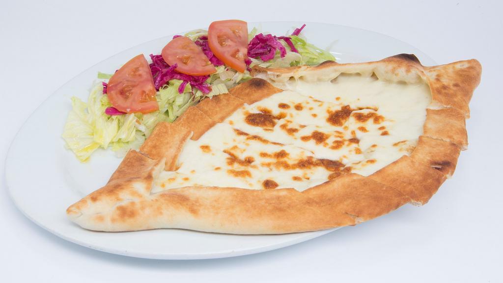 Cheese Pide · Vegetarian. Thick dough stuffed with a cheese blend, baked in a brick oven. Served with a side salad.
