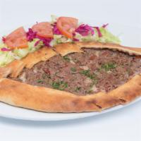 Beef Stew Pide · Thick dough stuffed with tender little pieces of meat, baked in a brick oven. Served with a ...