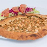 Chicken Stew Pide · Thick dough stuffed with tender little pieces of chicken, baked in a brick oven. Served with...