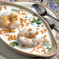 Curd Vada (2 Nos) · Crispy lentil doughnut in fresh yogurt garnished with grated carrot and cilantro.