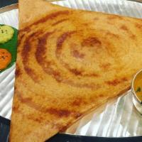 Mysore Masala Dosa · Red chili chutney spread on thin rice and lentil crepe filled with mashed potatoes and onion...