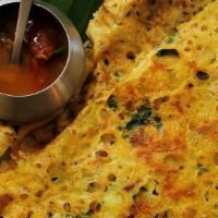 Onion Rava Masala Dosa · Thin crispy wheat and rice crepe stuffed with mildly spiced mashed potatoes and onions. Serv...