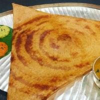 Onion Masala Dosa · Thin rice and lentil crepe filled with potatoes and onion. Served with three varieties of ch...