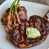Ribeye · your choice of: garlic butter, cajun butter, or simply grilled. served w/ bacon wrapped aspa...