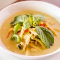 Green Curry · Spicy. Prepared with green curry paste, coconut milk, bamboo
shoot, bell pepper, and fresh b...