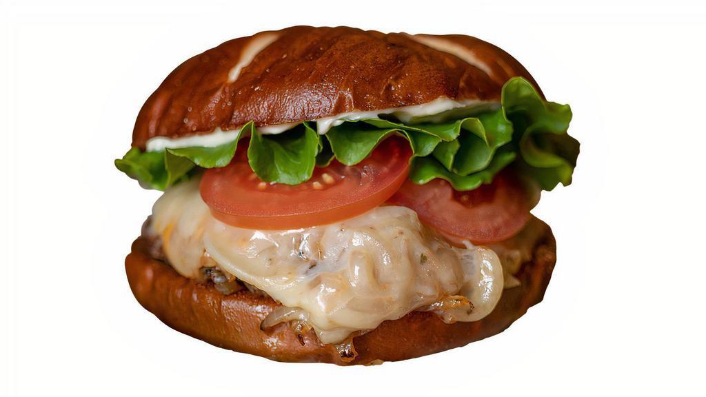 Dakota Burger Single · Certified Angus Beef, Spicy grilled onions, aged cheddar, swiss, lettuce, tomato & mayo on a pretzel bun.