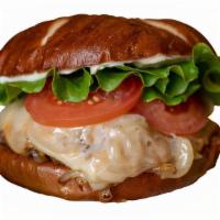 Dakota Turkey Single · Grilled Turkey burger, Spicy grilled onions, aged cheddar, swiss, lettuce, tomato & mayo on ...