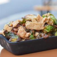 Kimchi Bacon Brussels · Crispy fried Brussels sprouts and bacon tossed in kimchi barbecue and topped with crispy won...