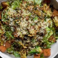 Chomp Caesar · Chopped romaine tossed in chomp Caesar dressing, topped with crispy shredded brussels sprout...