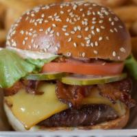 House Burger · Our signature burger, smoked Gouda, house cured bacon, Chomp Sauce, lettuce, tomato, pickles