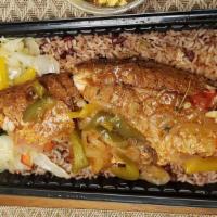 Brown Stew Fillet Snapper · Fried red snapper fish, simmered in a sweet and savory tomato base sauce, herbs and spices a...