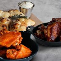 Wings (12) + Knots · 12 chicken wings with your choice of sauce and a free order of knots