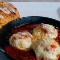 Meatballs · chicken meatballs, organic tomato sauce, house-made garlic rosemary bread