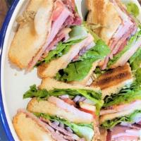 Triple Lane Club Sandwich · Smoked turkey, Applewood smoked bacon, carved ham, green leaf lettuce, tomato, Texas Toast, ...