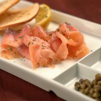 Rope Smoked Salmon · Rope smoked salmon served with bagel chips, everything mascarpone smear, diced red onion and...