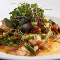 Lobster Ravioli · 4 lobster ravioli, tossed with crab, roasted red and yellow peppers and butter, garnished wi...