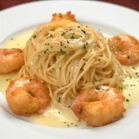 Shrimp Paesano · 5 jumbo shrimp lightly dusted in flour, pan sautéed and baked, served with spaghetti with bu...