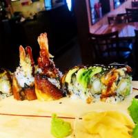 Black Dragon Roll · Shrimp tempura and cucumber inside, topped with eel, avocado and black tobiko.