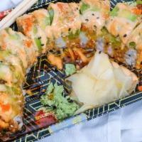 Dragon Roll · Shrimp tempura and cream cheese, avocado on top with masage eel sauce and spicy mayo.