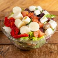 Greek Salad · Choice of greens, feta cheese, Kalamata olives, tomatoes, heart of palm, roasted red peppers...