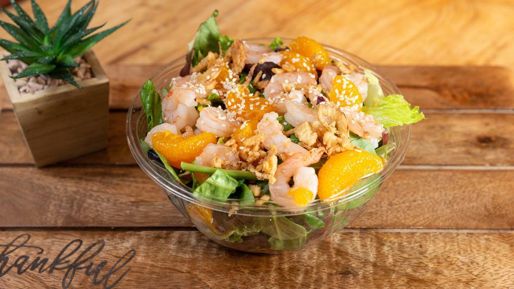 Sesame Shrimp Salad · Choice of greens, shrimp, mandarin oranges, sesame seeds, wonton strips, old bay seasoning and Asian sesame.