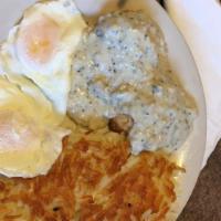 Biscuits And Gravy · Sausage Gravy over 2 biscuits ,served with 2 eggs and crisp hash browns.